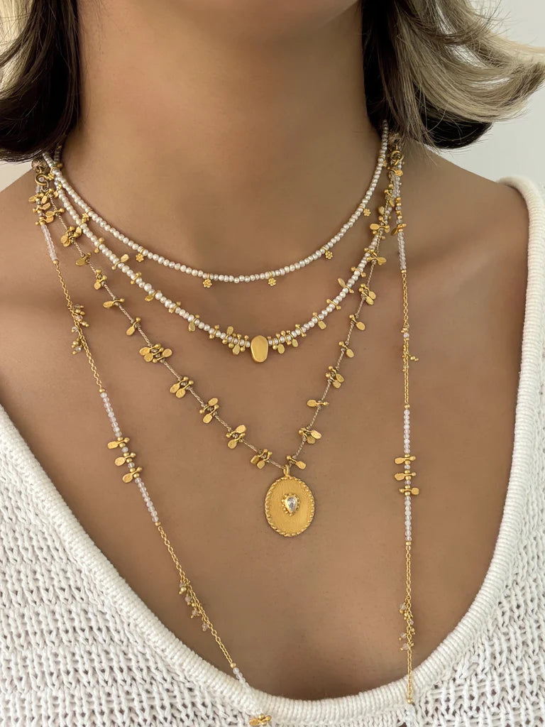 Pearl beaded necklace with gold charms